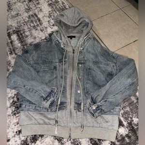 Denim jacket with layered hoodie design